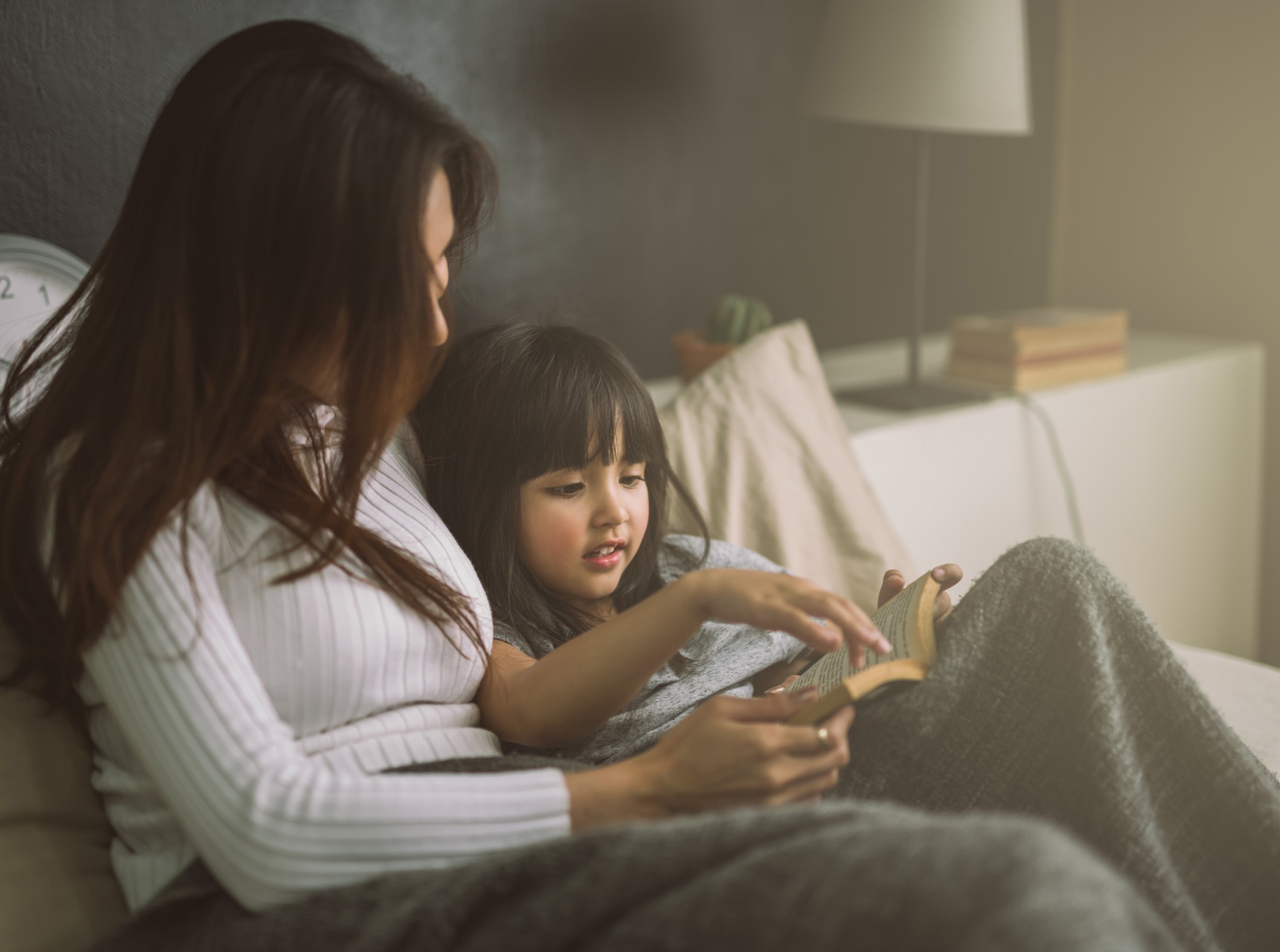 Mom and Daughter Reading a Book